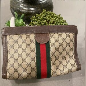 Authentic used GUCCI CLUTCH BAG 11 inches across and 7 inches in length.